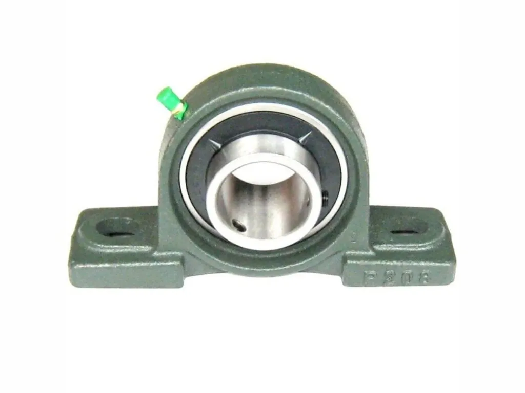 Gối đỡ UCP: Gối đỡ UCP xanh lục cận cảnh, hai lỗ bắt chân dài và vú mỡ