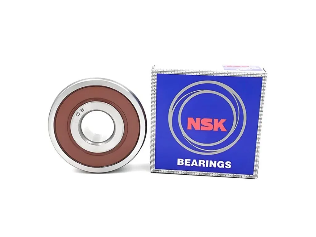 Vòng bi NSK: Vòng bi nắp cao su nâu cạnh hộp NSK xanh