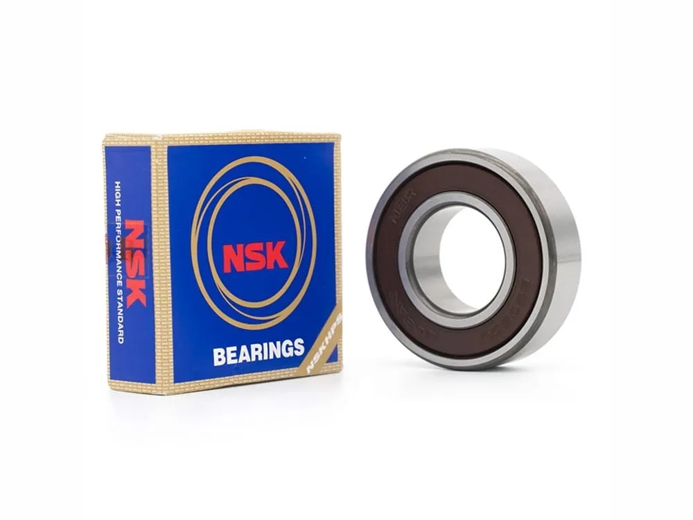 Vòng bi NSK: Vòng bi nắp cao su nâu cạnh hộp NSK xanh vàng