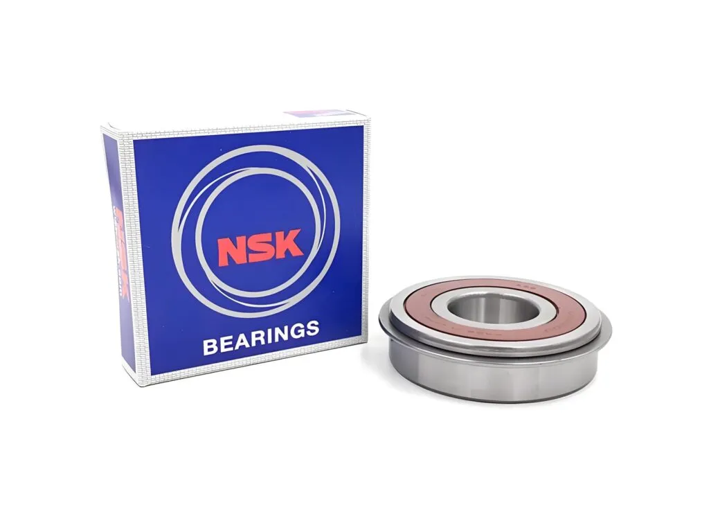 Vòng bi NSK: Vòng bi nắp cao su nâu có vành gờ, đặt cạnh hộp NSK